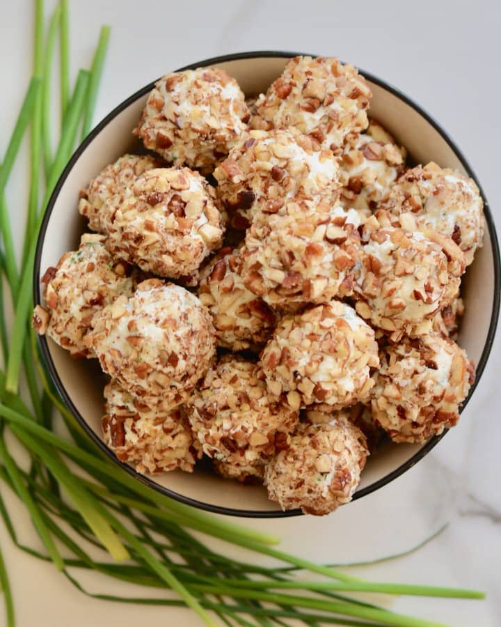 Creamy Cheese Grape Clusters Appetizer - gorgonzola, chives, pecans and cream cheese on grapes. So fresh and delicious and really unique. These are always the first to go at any party!