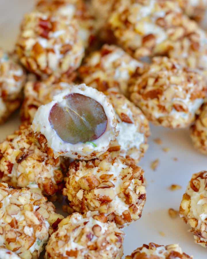 Creamy Cheese Grape Clusters Appetizer - gorgonzola, chives, pecans and cream cheese on grapes. So fresh and delicious and really unique. These are always the first to go at any party!