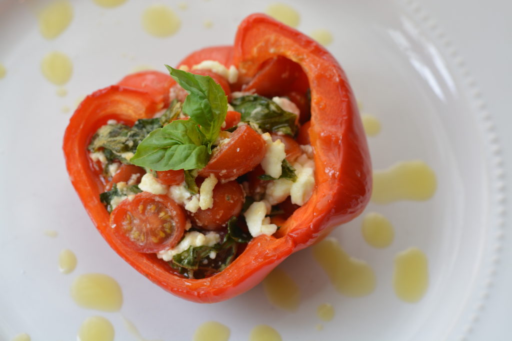 Italian Stuffed Peppers - full of fresh tomatoes, basil and feta. Drizzled with olive oil and salt. So amazing and so simple! Perfect appetizer for your next Italian meal.