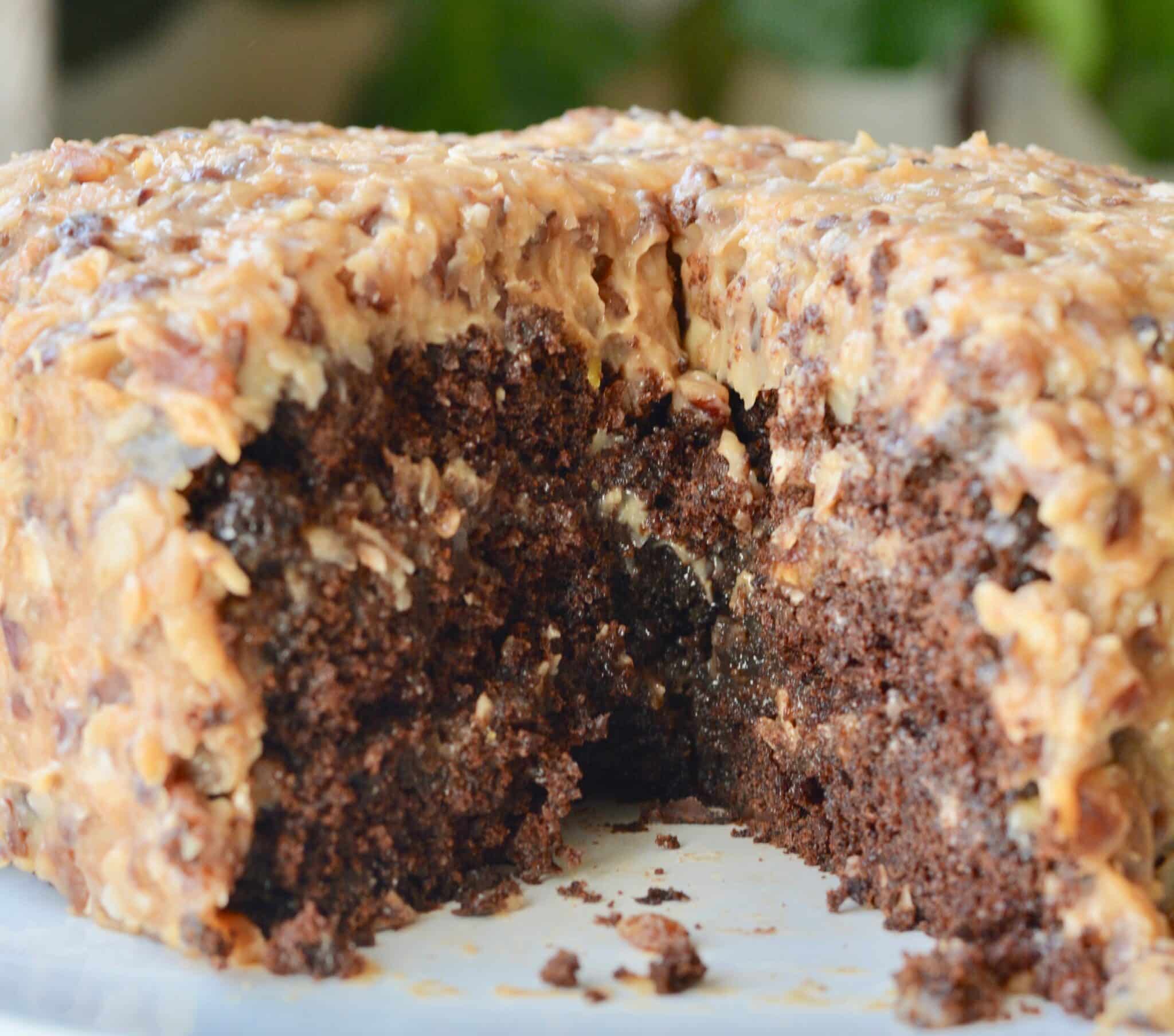 Perfectly dense German Chocolate Cake. Made with chocolate chips, plenty of coconut and pecans. Perfect for a birthday or any celebration!