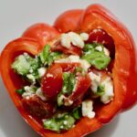 Healthy Italian Stuffed Peppers | Gluten Free Vegetarian appetizer or lunch. So fresh and delicious and easy to throw together. Cherry tomatoes, feta cheese, basil and olive oil stuffed into a red pepper and heated through. Absolutely delicious!