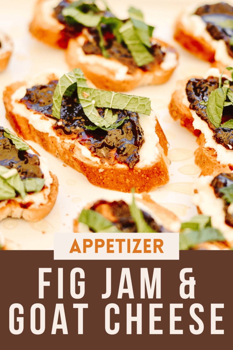 Crostini with goat cheese, fig jam, honey and mint on a plate.