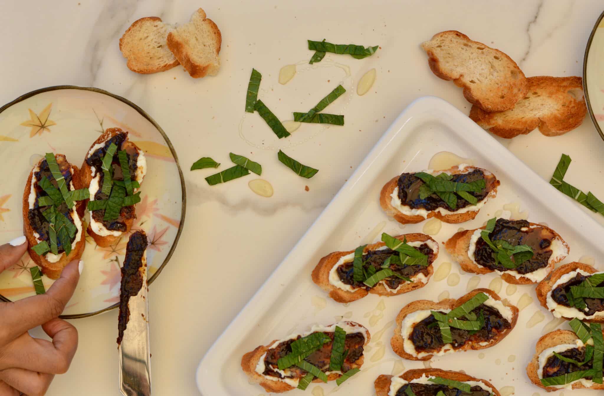Goat Cheese Crostini Appetizer with Honey, Fig Jam and Fresh Mint.