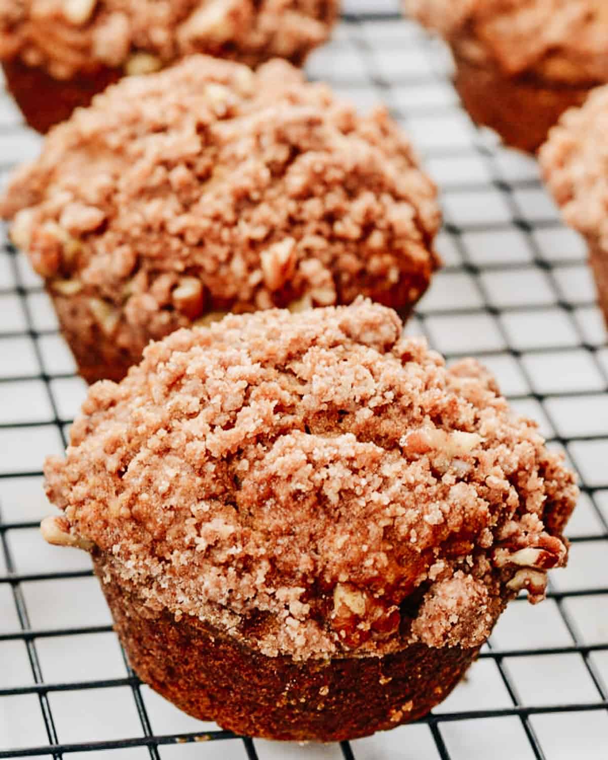 Pumpkin muffins on a cooling rack.