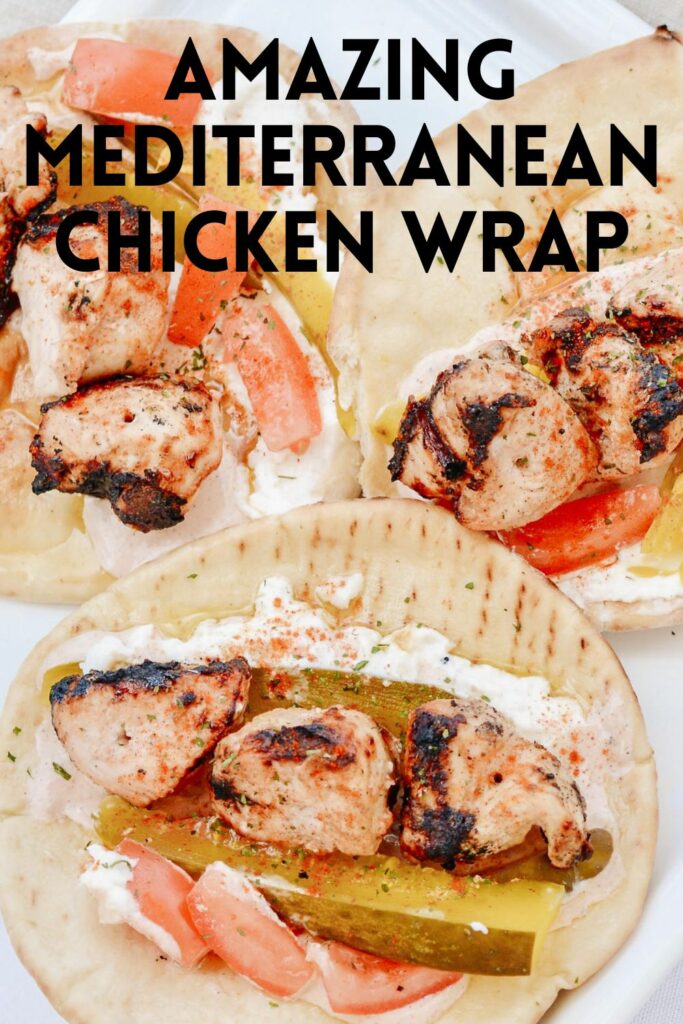 Chicken Tawook Pita Sandwich - Lebanese flavors with grilled chicken, perfectly spiced marinade and sauces, along with tomatoes, pickles and packed with tons of authentic, but easy flavor. #tawook #lebanese #chickendinner