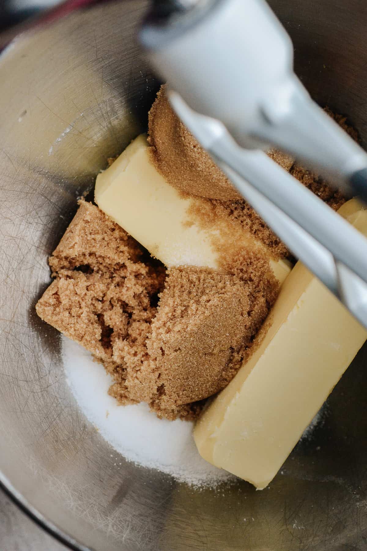 Mixing bowl with butter, brown sugar, white sugar and ground espresso.