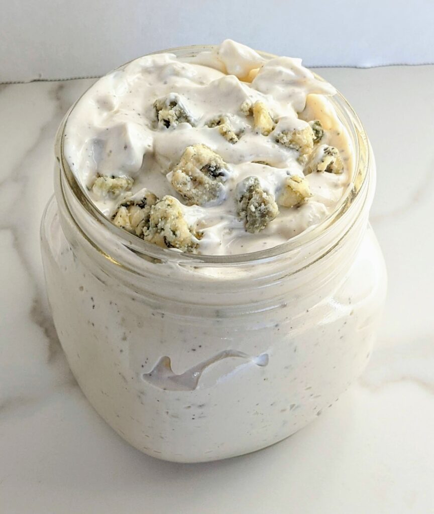 The BEST homemade Blue Cheese Dressing and Dip. A secret ingredient sets it apart from the rest and takes this blue cheese dressing to a whole other level! Perfect for dipping chips, fries, or on top of salad.