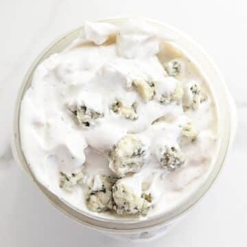 The BEST homemade Blue Cheese Dressing and Dip. A secret ingredient sets it apart from the rest and takes this blue cheese dressing to a whole other level! Perfect for dipping chips, fries, or on top of salad.