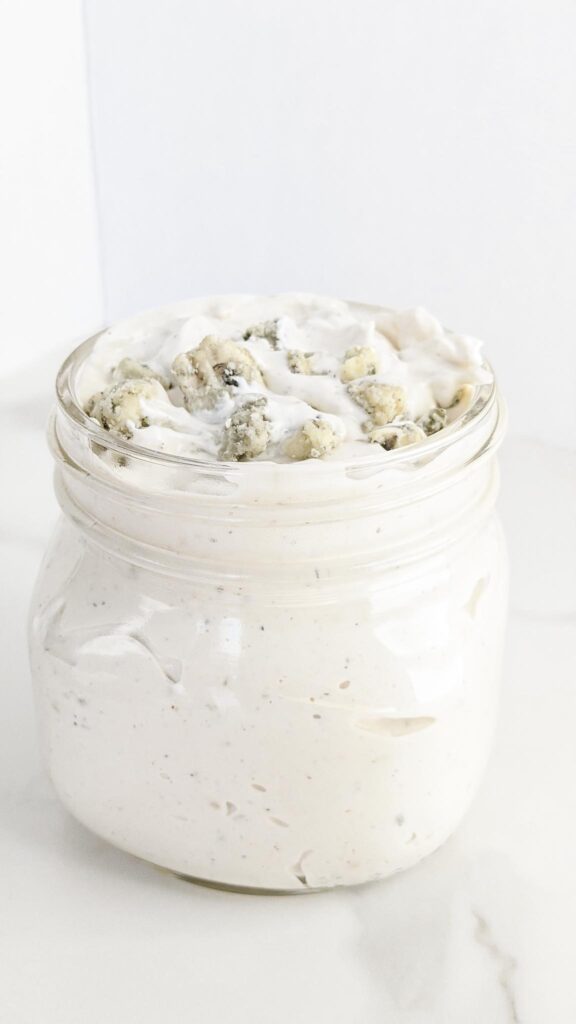 The BEST homemade Blue Cheese Dressing and Dip. A secret ingredient sets it apart from the rest and takes this blue cheese dressing to a whole other level! Perfect for dipping chips, fries, or on top of salad.