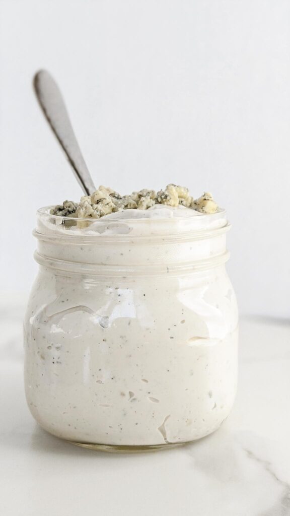 The BEST homemade Blue Cheese Dressing and Dip. A secret ingredient sets it apart from the rest and takes this blue cheese dressing to a whole other level! Perfect for dipping chips, fries, or on top of salad.