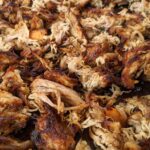 Carnitas made so full of flavor and so simple to make in a slow cooker or crock pot. Coca cola, orange juice, onion and spices flavor our pork shoulder or butt. YUM!