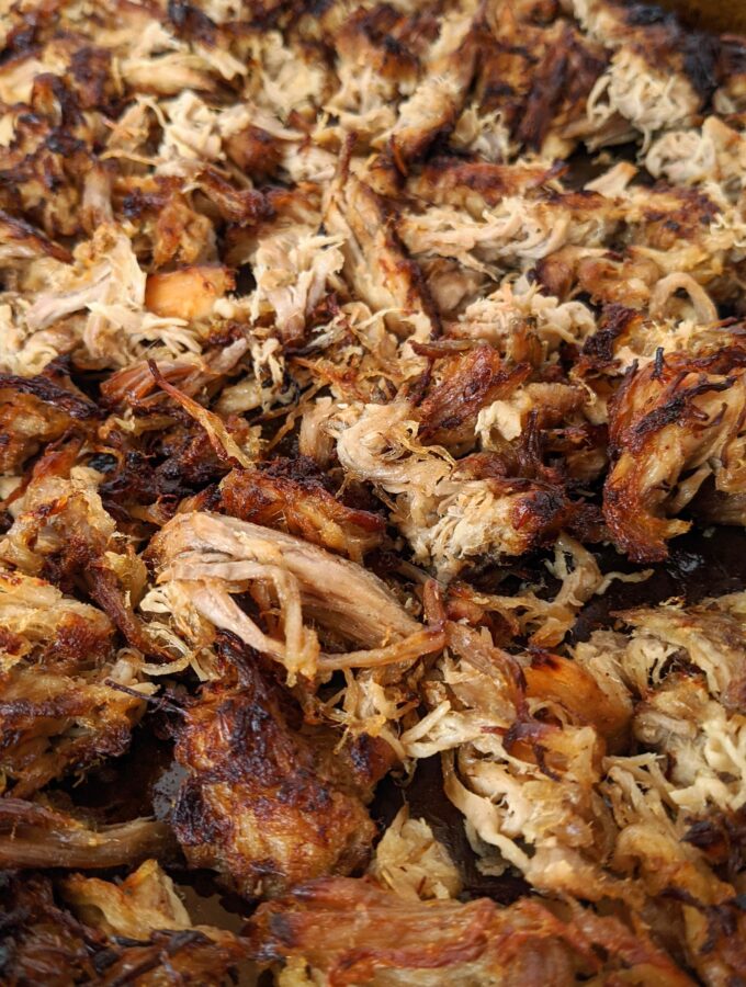 Carnitas made so full of flavor and so simple to make in a slow cooker or crock pot. Coca cola, orange juice, onion and spices flavor our pork shoulder or butt. YUM!
