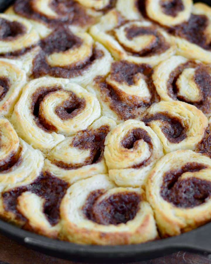 Mini Biscuit Cinnamon Rolls | Super quick recipe with no rise time. Perfectly flaky, full of cinnamon and sugar and covered in icing perfection!