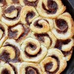 Mini Biscuit Cinnamon Rolls | Super quick recipe with no rise time. Perfectly flaky, full of cinnamon and sugar and covered in icing perfection!