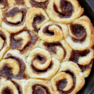 Mini Biscuit Cinnamon Rolls | Super quick recipe with no rise time. Perfectly flaky, full of cinnamon and sugar and covered in icing perfection!