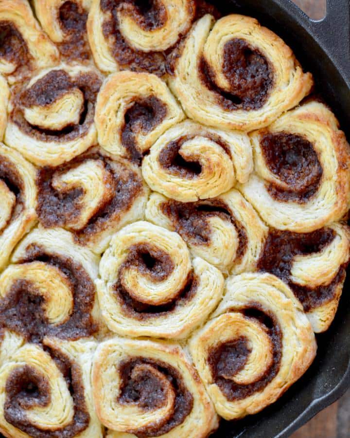 Mini Biscuit Cinnamon Rolls | Super quick recipe with no rise time. Perfectly flaky, full of cinnamon and sugar and covered in icing perfection!