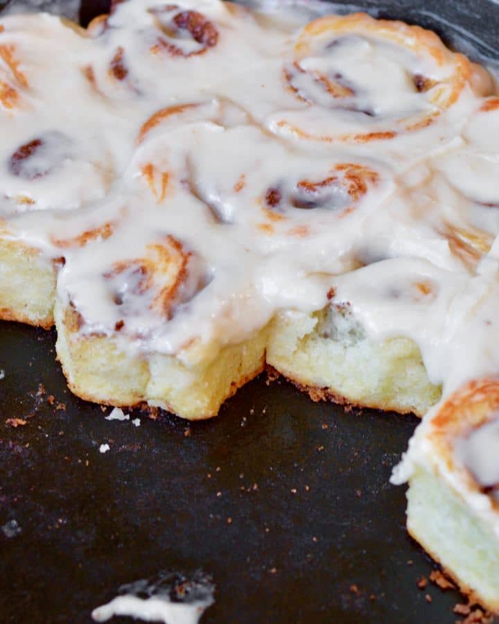 Mini Biscuit Cinnamon Rolls | Super quick recipe with no rise time. Perfectly flaky, full of cinnamon and sugar and covered in icing perfection!
