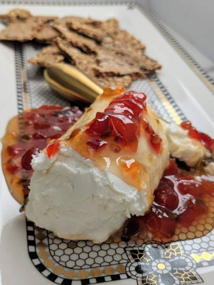 Goat Cheese and Red Pepper Jelly Appetizer | only 2 ingredients. The perfect party appetizer. Sweet, spicy and tart, the perfect combination!