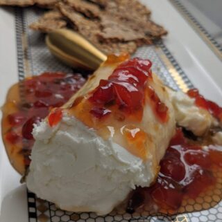 Goat Cheese and Red Pepper Jelly Appetizer | only 2 ingredients. The perfect party appetizer. Sweet, spicy and tart, the perfect combination!