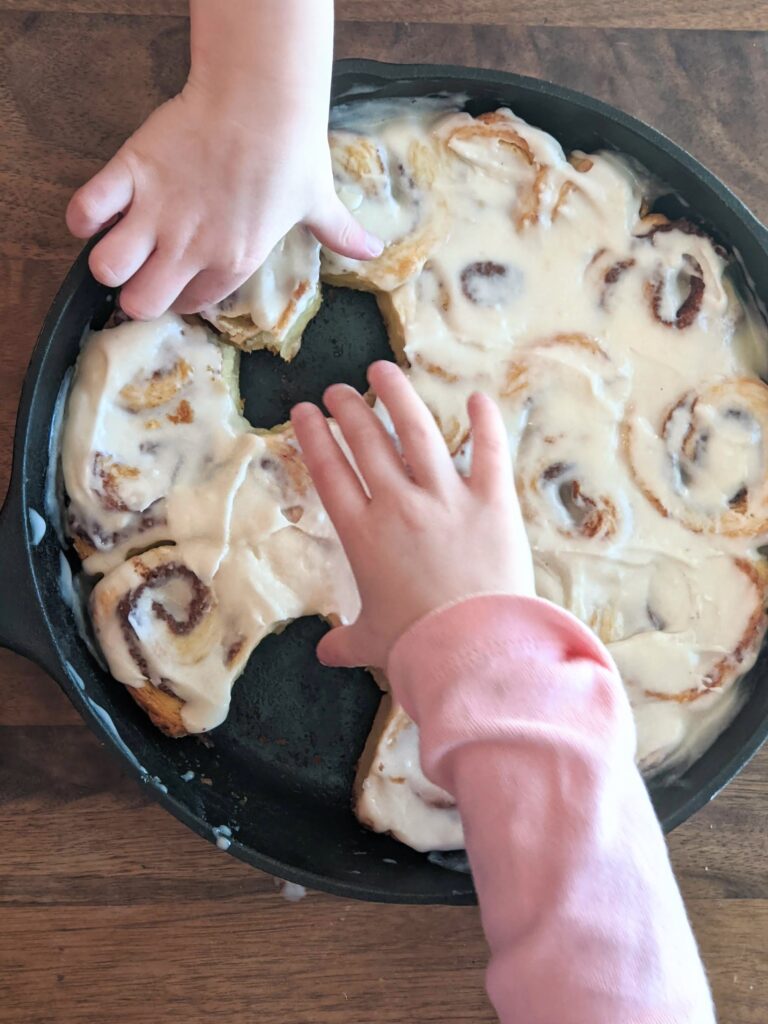 Mini Biscuit Cinnamon Rolls | Super quick recipe with no rise time. Perfectly flaky, full of cinnamon and sugar and covered in icing perfection!