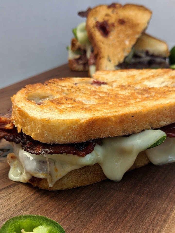 Jalapeño Blackberry Bacon Grilled Cheese | Mix up your grilled cheese night with this amazing flavor combination! Blackberry jam, jalapeño, bacon and your favorite cheese all on toasted sourdough bread. YUM!