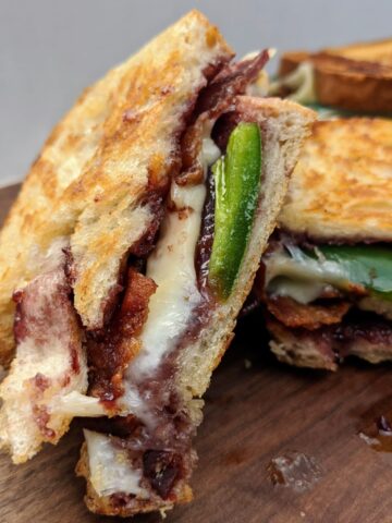 Jalapeño Blackberry Bacon Grilled Cheese | Mix up your grilled cheese night with this amazing flavor combination! Blackberry jam, jalapeño, bacon and your favorite cheese all on toasted sourdough bread. YUM!