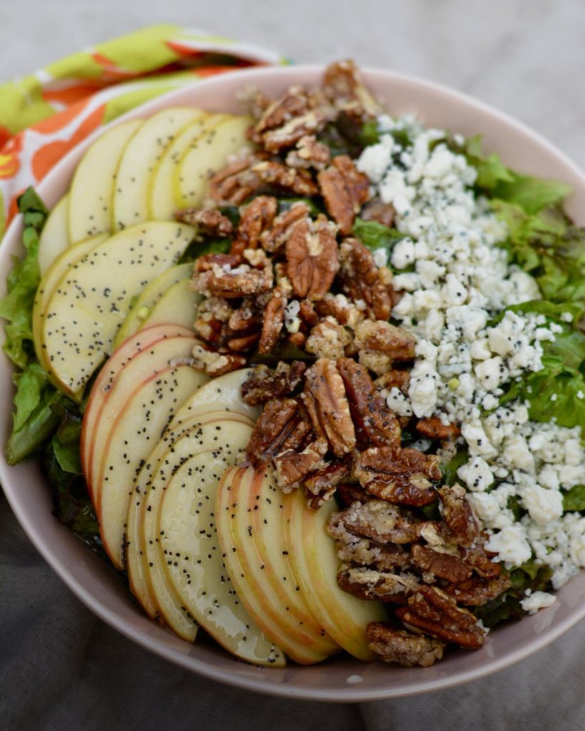 Delicious summer salad with candied spiced pecans, apples, blue cheese and homemade poppy seed dressing. YUM!