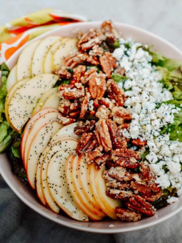 Ultimate Summer Salad Recipe - crisp apples, tangy blue cheese, sweet pecans and homemade poppy seed dressing. Total perfection for summer lunch or dinner.