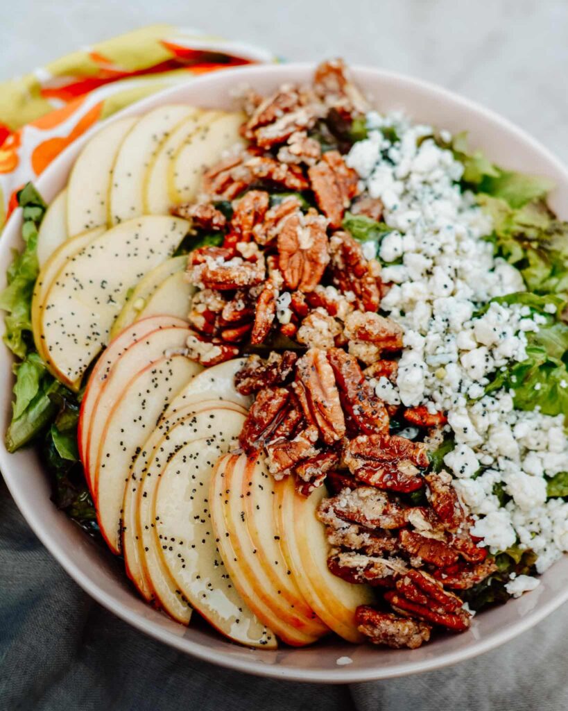 Ultimate Summer Salad Recipe - crisp apples, tangy blue cheese, sweet pecans and homemade poppy seed dressing. Total perfection for summer lunch or dinner.