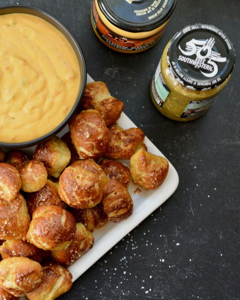 Pretzel Bites with a Kick! Adding fresh 505 Southwestern salsa right in the dough makes these pretzel bites really special. Dip in queso for the ultimate snack. #505southwestern #salsa #pretzels