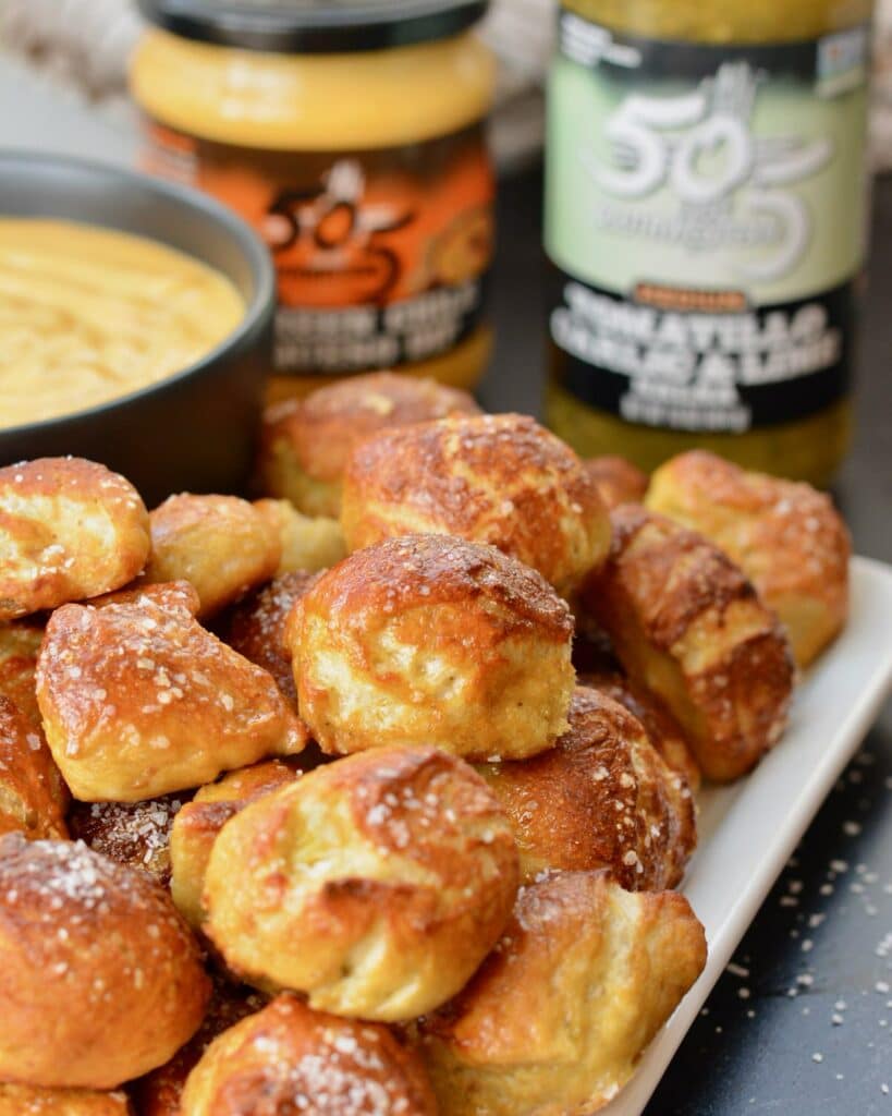 Pretzel Bites with a Kick! Adding fresh 505 Southwestern salsa right in the dough makes these pretzel bites really special. Dip in queso for the ultimate snack. #505southwestern #salsa #pretzels