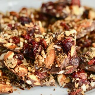 Grain Free Granola and Cranberry Chocolate Bark | Perfect Holiday Snack or Gift. Dark chocolate topped with lightly sweetened grain free granola and dried cranberries. Delicious!