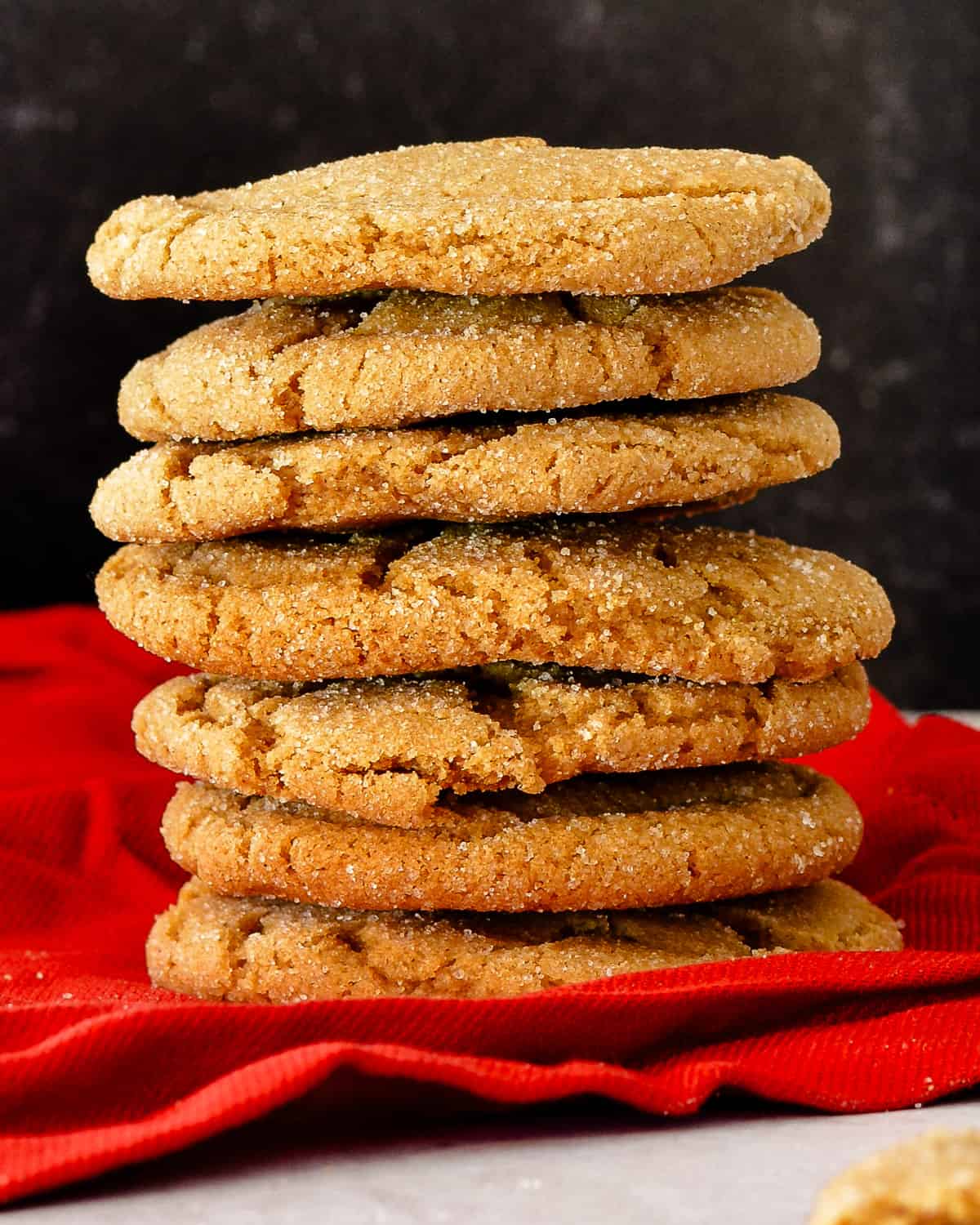 Stack of cookies on red fabric.