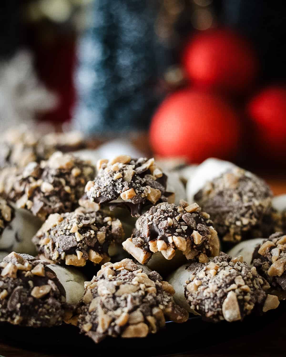 Cookies up close, christmas decorations in background.