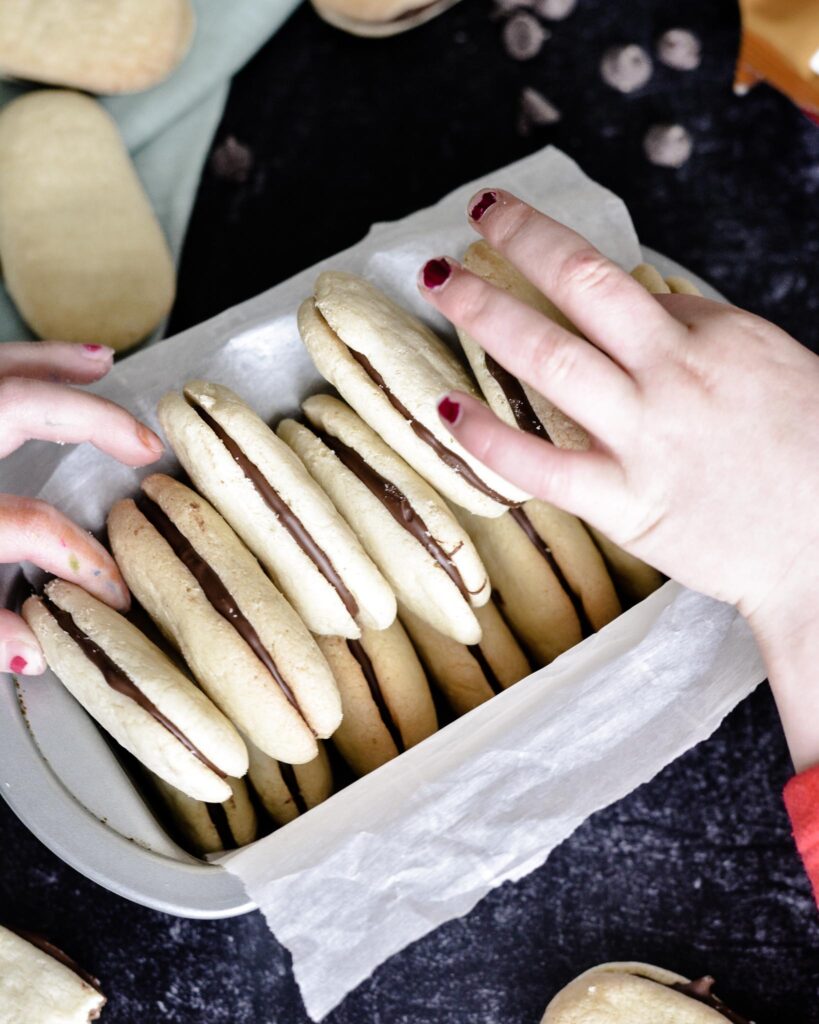 Copycat Milano Cookies | Gluten free and Dairy free. Perfectly crispy cookie with dark chocolate filling. Very simple recipe.