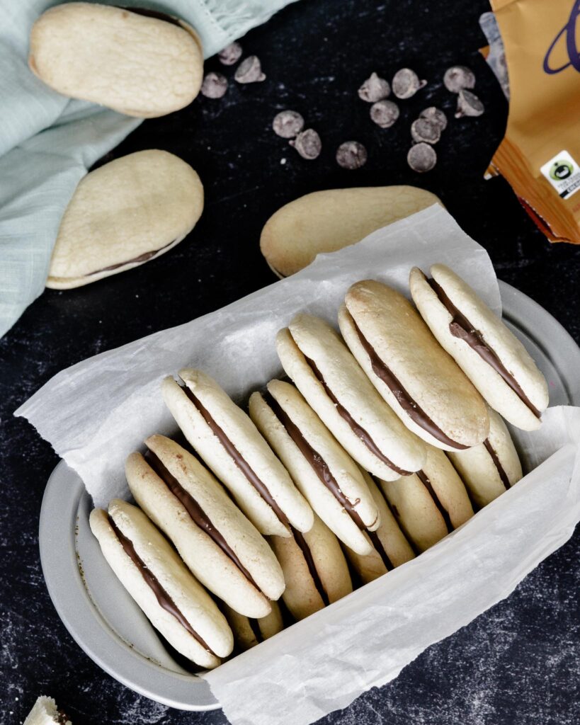 Copycat Milano Cookies | Gluten free and Dairy free. Perfectly crispy cookie with dark chocolate filling. Very simple recipe.