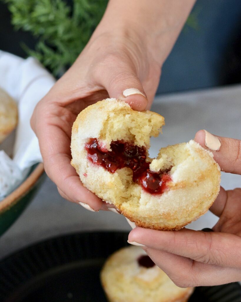 Sweet Donut Muffins made gluten free in this simple one bowl recipe. Why have just a muffin, when you can have a donut muffin? Filled with raspberry jam and relaxing moments. Perfect grab and go breakfast the whole family will treasure.