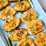 Fully Loaded Twice Baked Potatoes | Stuffed with cream cheese, cheddar, bacon, green onion and TONS of flavor. The perfect summer appetizer or side dish.