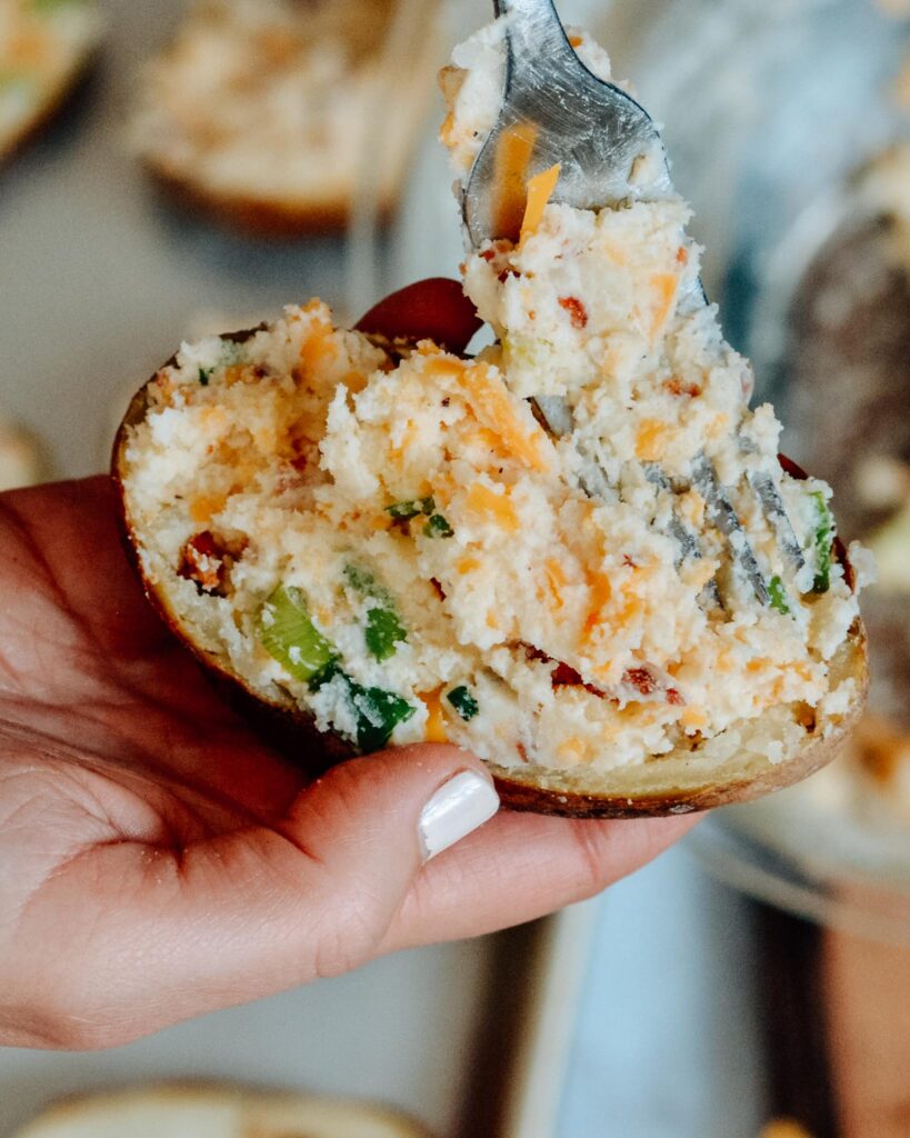 Fully Loaded Twice Baked Potatoes | Stuffed with cream cheese, cheddar, bacon, green onion and TONS of flavor. The perfect summer appetizer or side dish.