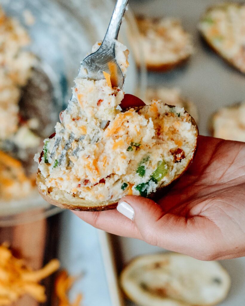 Fully Loaded Twice Baked Potatoes | Stuffed with cream cheese, cheddar, bacon, green onion and TONS of flavor. The perfect summer appetizer or side dish.