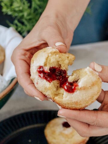 Sweet Buttermilk Muffins filled with raspberry preservesmade gluten free in this simple one bowl recipe. Why have just a muffin, when you can have a donut muffin? Filled with raspberry jam and relaxing moments. Perfect grab and go breakfast the whole family will treasure.