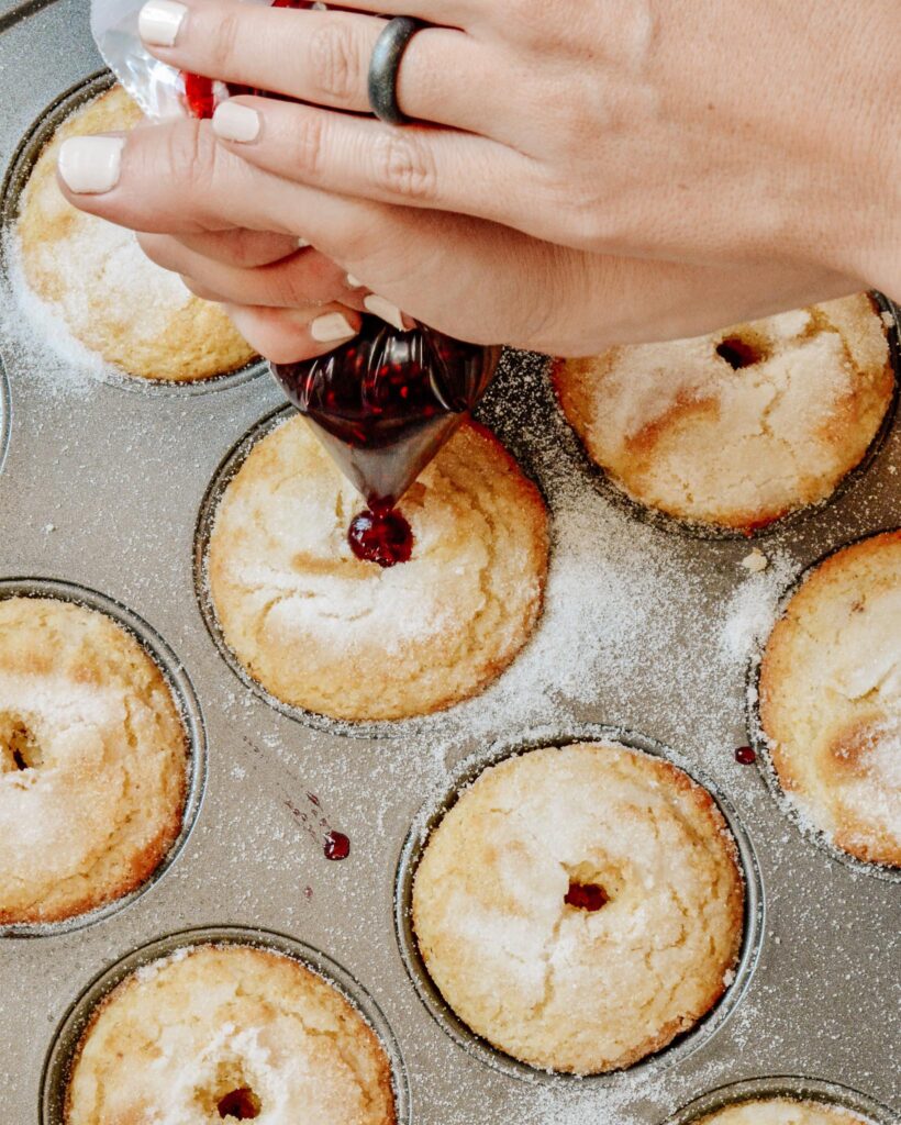 Sweet Buttermilk Muffins filled with raspberry preservesmade gluten free in this simple one bowl recipe. Why have just a muffin, when you can have a donut muffin? Filled with raspberry jam and relaxing moments. Perfect grab and go breakfast the whole family will treasure.