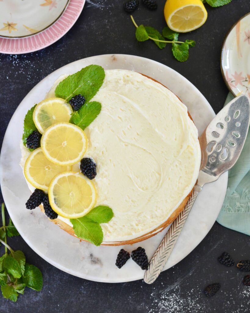 Gluten Free Lemon Layer Cake for the win! The perfect summer dessert. So festive and beautiful. The perfectly light, fluffy cake, layered with lemon buttercream and lemon curd. Add blackberries or any summer fruit for a delightful summer flavor. 