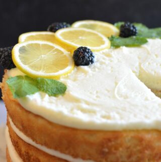 Lemon Layer Cake for the win! The perfect summer dessert. So festive and beautiful. The perfectly light, fluffy cake, layered with lemon buttercream and lemon curd. Add blackberries or any summer fruit for a delightful summer flavor. Gluten Free Option.