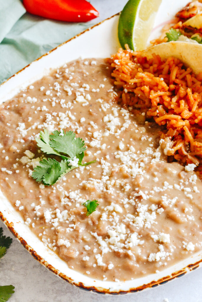 Restaurant style refried beans made in the Instant Pot. Totally easy and way better than the stuff out of the can!