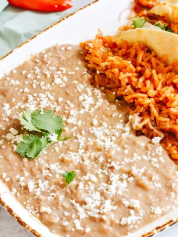 Restaurant style refried beans made in the Instant Pot. Totally easy and way better than the stuff out of the can!