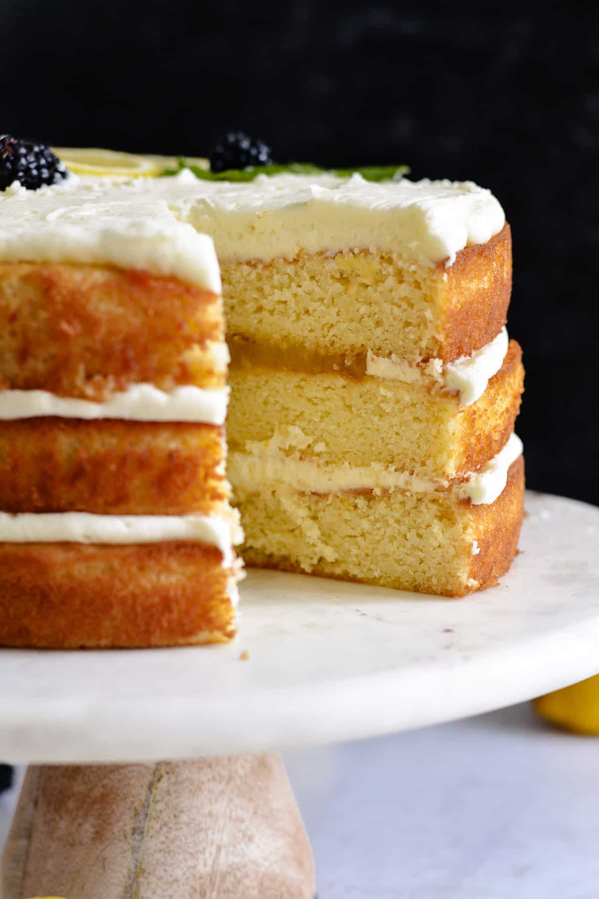 Sliced lemon layered cake on a cake plate