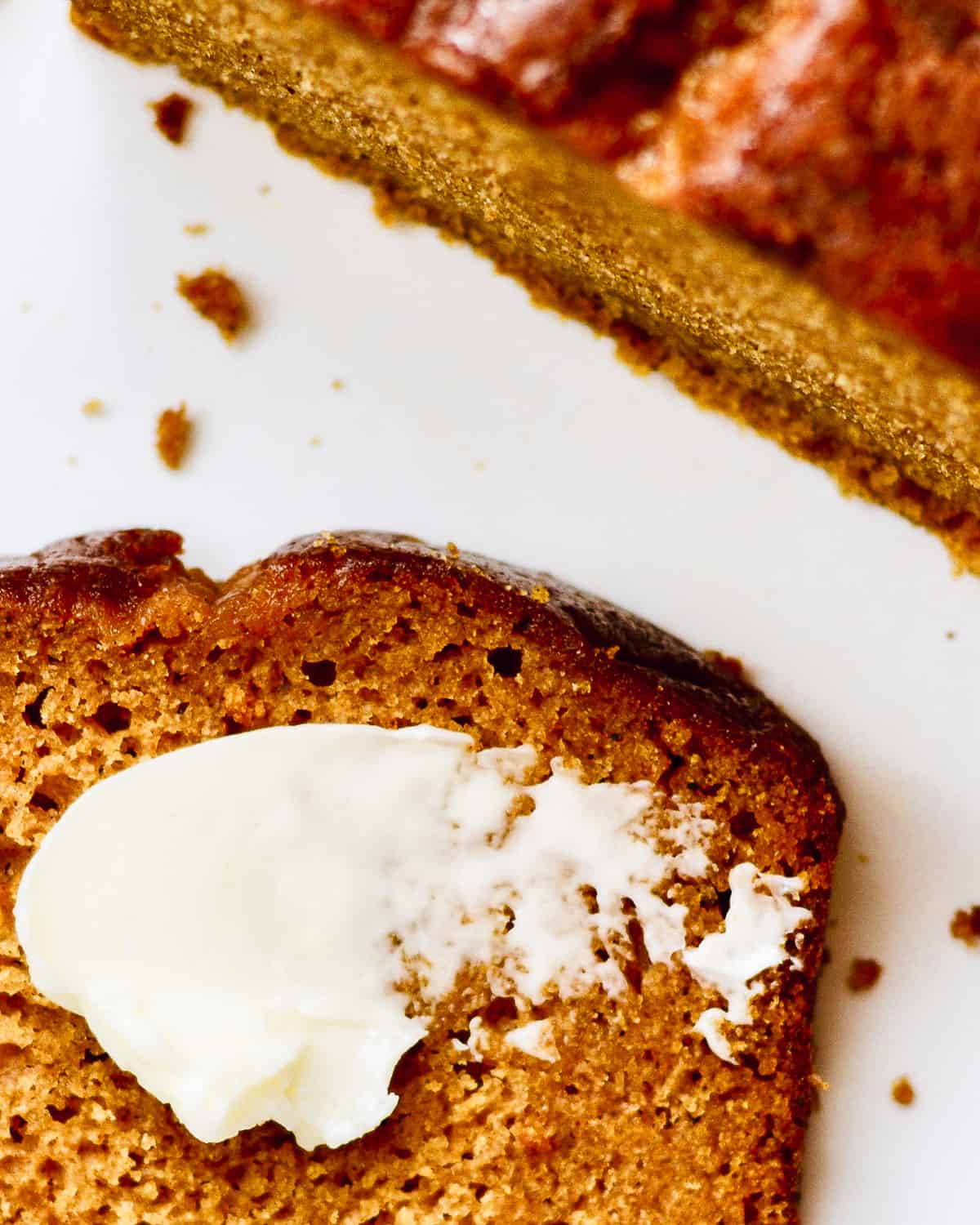 Slice of pumpkin bread with butter.