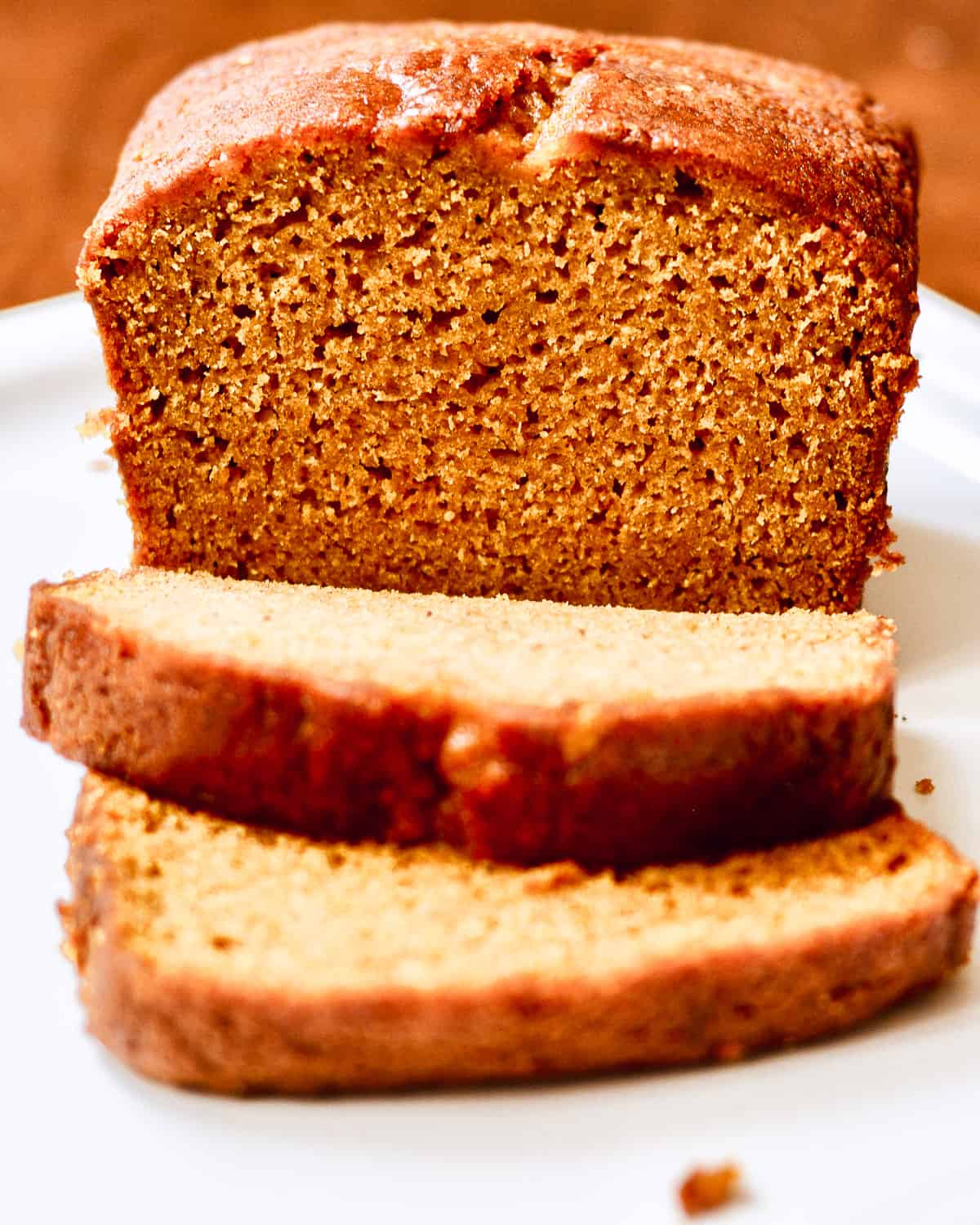 Loaf of pumpkin bread sliced.