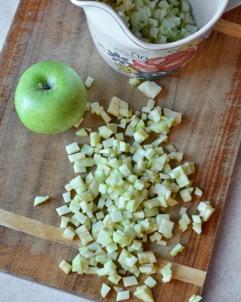 Apple Cinnamon Muffins full of chopped apples and cinnamon. Deliciously moist muffins that come together in a flash! Use up those extra apples and bake up these family favorites today!